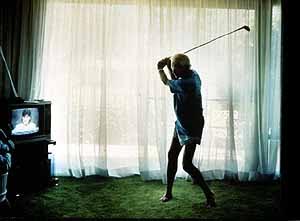 practicing golf swing by Larry Sultan